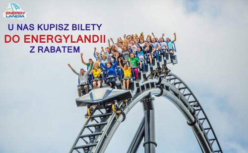 a group of people on a roller coaster at an amusement park at Hostel 33 in Trzebinia