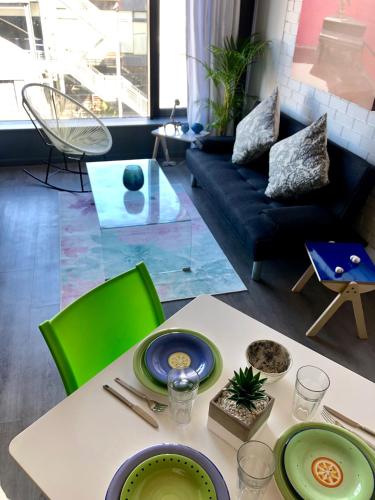 a living room with a table and a couch at Wex 1 Apartments in Cape Town