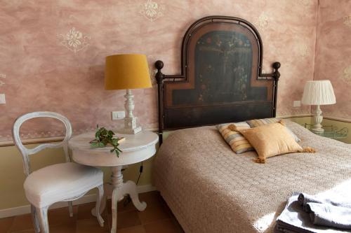 En eller flere senge i et værelse på Dogana d'Acqua Rooms & Art
