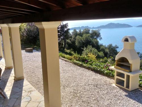 a view from the porch of a house overlooking the water at Holiday home with stunning views near Afionas in Afionas