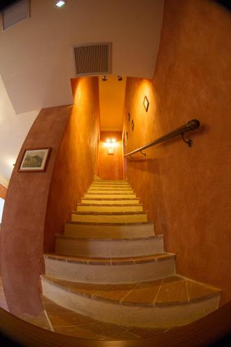 a staircase in a building with a stair case at Tenuta Isola in Langosco