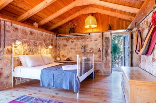 a bedroom with a bed in a room with wooden ceilings at 3 Oda Kaş in Kas