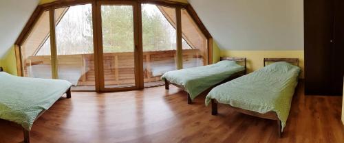 Ένα ή περισσότερα κρεβάτια σε δωμάτιο στο Leimaņi