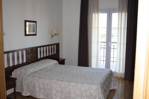 Postel nebo postele na pokoji v ubytování Hotel Mar de Aragón