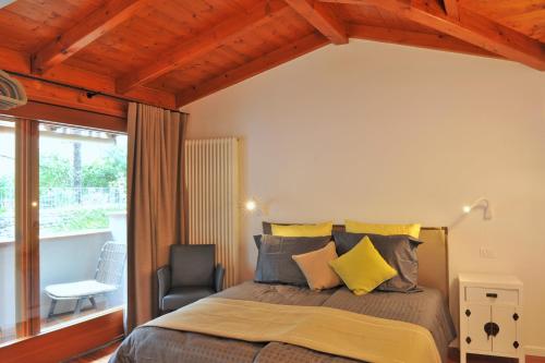 En eller flere senge i et værelse på Bella Vacanza Limone