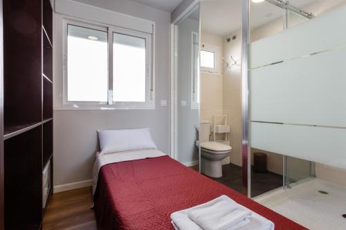 Ένα ή περισσότερα κρεβάτια σε δωμάτιο στο ALTAMAR Sunny Home by Cadiz4Rentals