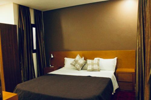 Letto o letti in una camera di CasaHouse Apparts