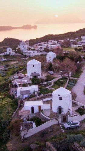 an aerial view of a small town with white buildings at Drougas' Windmill in Plaka Milou