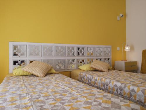 Ένα ή περισσότερα κρεβάτια σε δωμάτιο στο Sensations Guesthouse