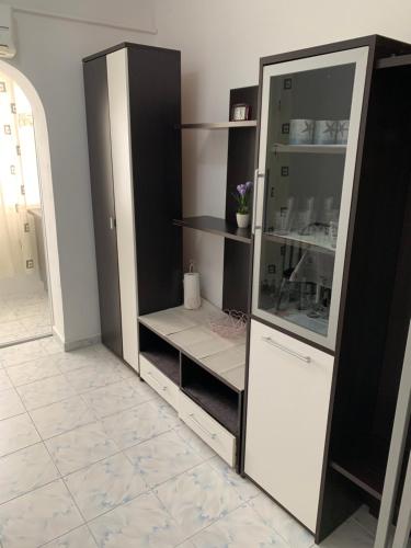 a black and white refrigerator in a room at Apartament Port Turistic Mangalia in Mangalia