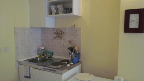 a kitchen with a sink and a counter top at Apartments Senko in Trpanj