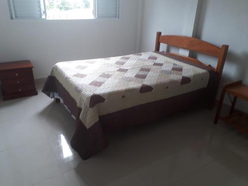 Ένα ή περισσότερα κρεβάτια σε δωμάτιο στο Pousada da Tia Cida