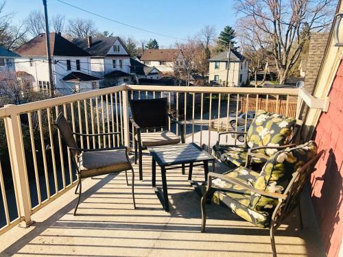 a balcony with two chairs and a table and a table at Redwood Bed and Breakfast in Niagara Falls