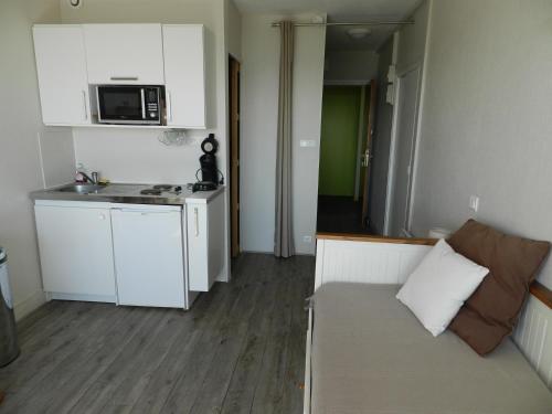 Η κουζίνα ή μικρή κουζίνα στο Appartement fort bloqué