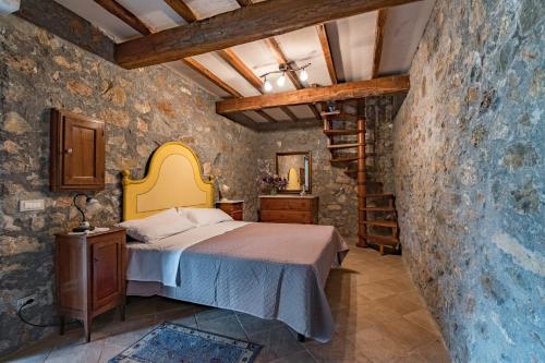 Кровать или кровати в номере Fattoria Ceragioli