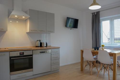 Kuchyňa alebo kuchynka v ubytovaní Apartamenty Asturia