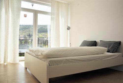 Un pat sau paturi într-o cameră la Villa Regina Serafina