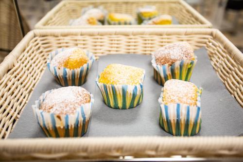 a basket full of cupcakes with sprinkles on it at Hotel Grazia Riccione in Riccione
