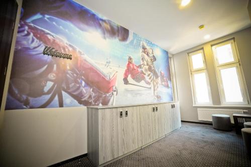 a room with a large painting on the wall at Olympic - Old Town in Gdańsk