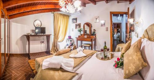 a bedroom with a bed with a teddy bear sitting on it at Villa Virginia in Vonitsa