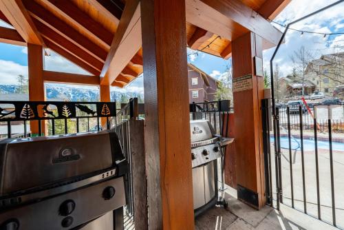 a outdoor kitchen with a grill and a stove at Timberline by FantasticStay in Fernie