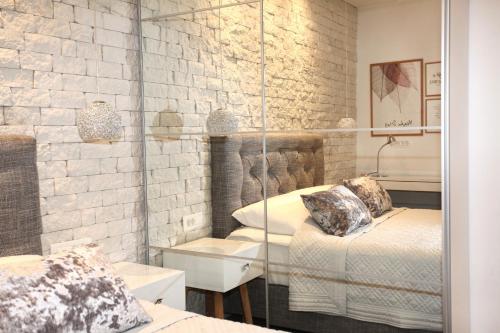 a room with two beds and a sink in it at Apartments Tessera in Split
