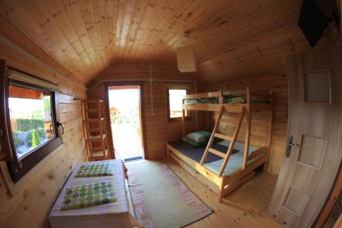 an overhead view of a wooden cabin with bunk beds at Słoneczna Polana in Solina