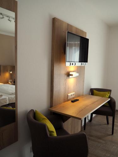 Postel nebo postele na pokoji v ubytování Gasthof Hotel Esterer