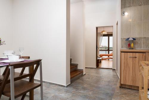 a kitchen with a table and a dining room at Sozopol Seaside Villa in Sozopol