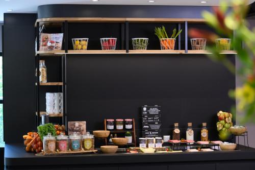 a display of food items on a shelf at Campanile Hotel & Restaurant Eindhoven in Eindhoven