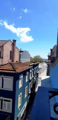 a row of buildings on a city street at Almar Apartments in Póvoa de Varzim