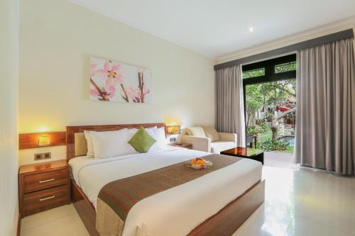 מיטה או מיטות בחדר ב-Argya Santi Resort
