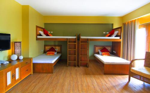 A bunk bed or bunk beds in a room at Boracay Tropics Resort Hotel