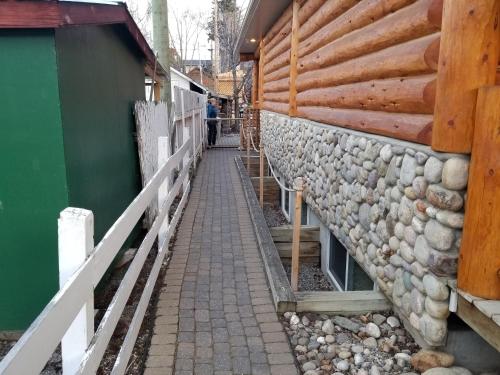 a wooden walkway leading up to a building at Roche Bonhomme Rustic Suite in Jasper