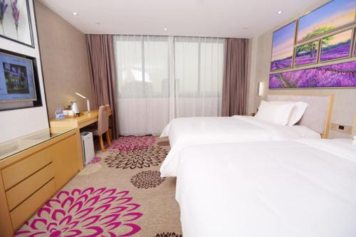 Voodi või voodid majutusasutuse Lavande Hotel (Foshan Shunde Shunlian Square) toas