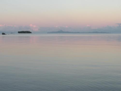 a view of the water at sunset at Fare Vahine Oviri - 1048DTO-MT in Uturoa