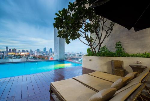 a view of a swimming pool from a building at Grand Howard Hotel Bangkok in Bangkok