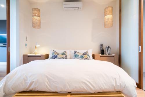 Ένα ή περισσότερα κρεβάτια σε δωμάτιο στο Aquabelle Apartments