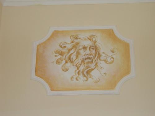 a painting of a lion on a wall at Casa Alla Fenice in Venice