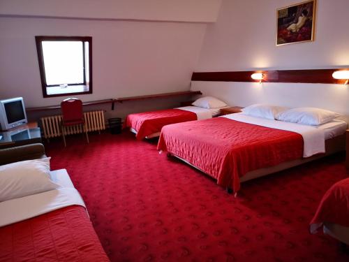 Giường trong phòng chung tại Motel Plitvice Zagreb