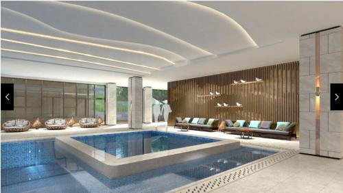 a living room with a large pool in the middle of it at Hyatt Regency Beijing Shiyuan in Yanqing