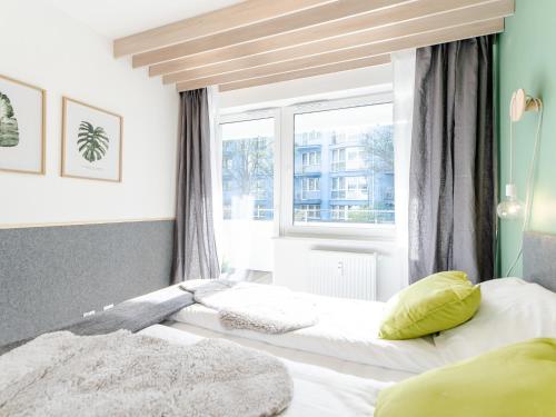 Posteľ alebo postele v izbe v ubytovaní Apartament FOREST SurfingBird Kołobrzeg