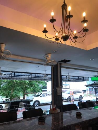 a chandelier hanging over a table in a restaurant at You Place in Pattaya