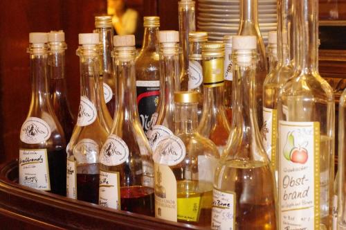 a group of bottles of wine on a shelf at Boutique Hotel & Bio Wirtshaus Schwarzer Bock in Ansbach