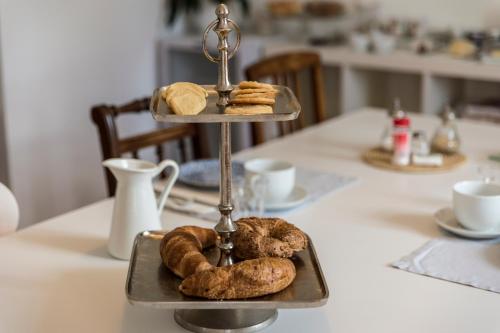 a tray with bread and pastries on a table at B&B villa sempreverde in Locarno