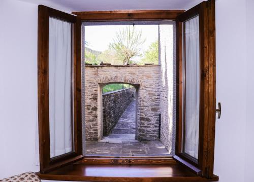 a window in a room with a brick wall at Il Palazzo Ridracoli in Bagno di Romagna