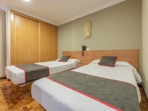 Кровать или кровати в номере Hotel Casa Marín