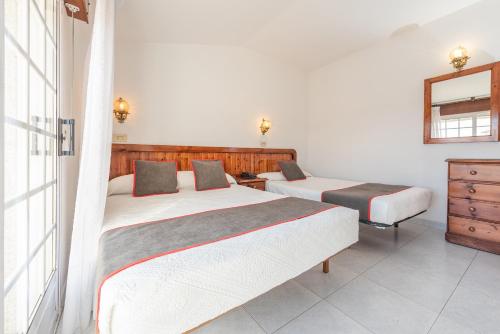 Кровать или кровати в номере Hotel Casa Marín