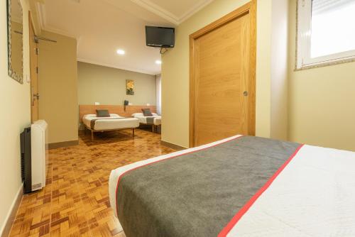 Кровать или кровати в номере Hotel Casa Marín