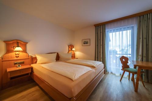 Postel nebo postele na pokoji v ubytování Parkhotel Sonnenhof